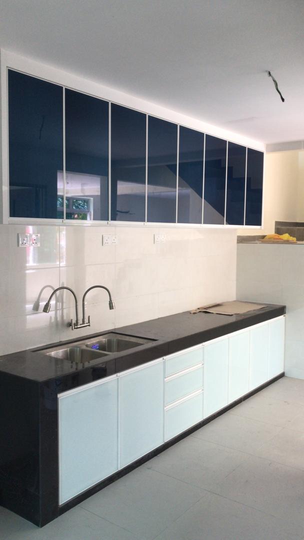 Kitchen with glass front upper cabinets