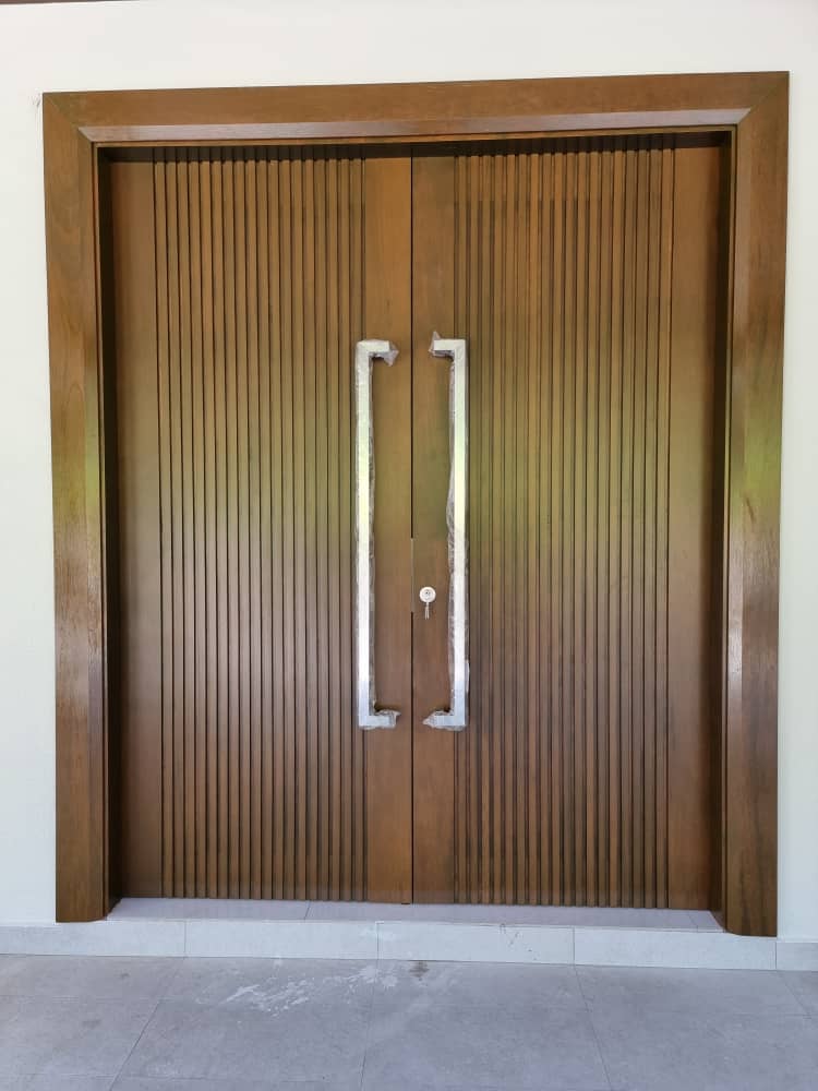 Solid wood double main door with vertical slat detail