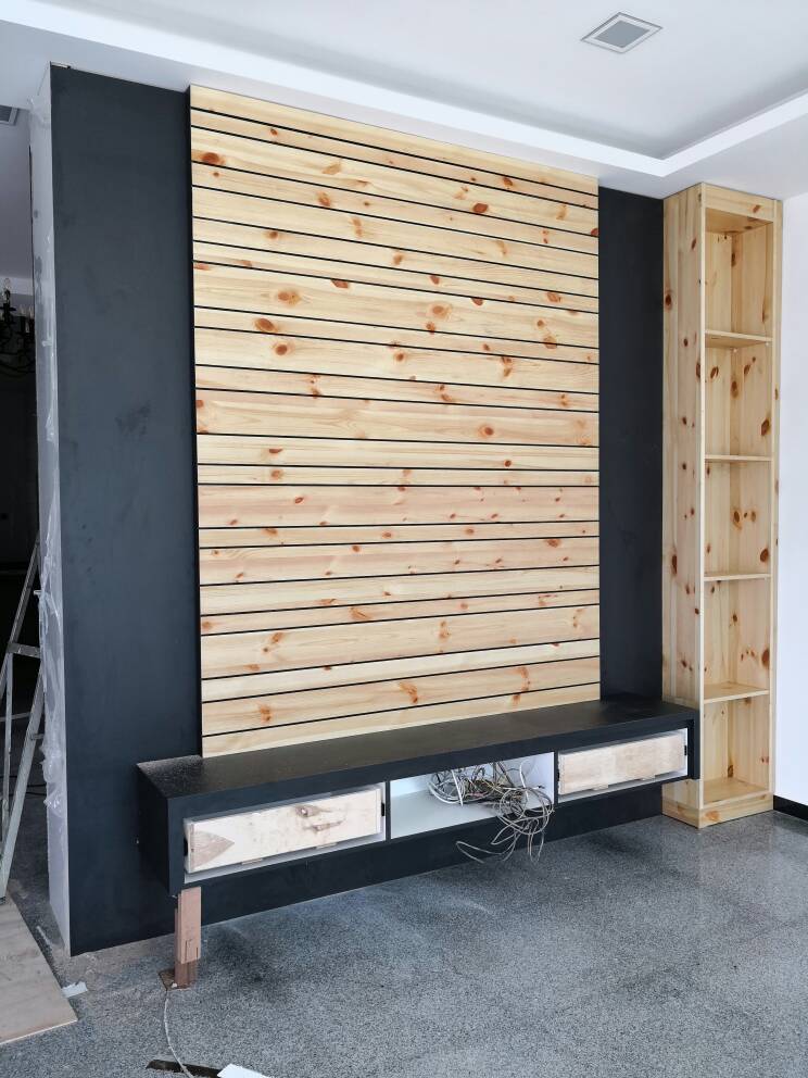 Pine slat TV feature wall with floating cabinet