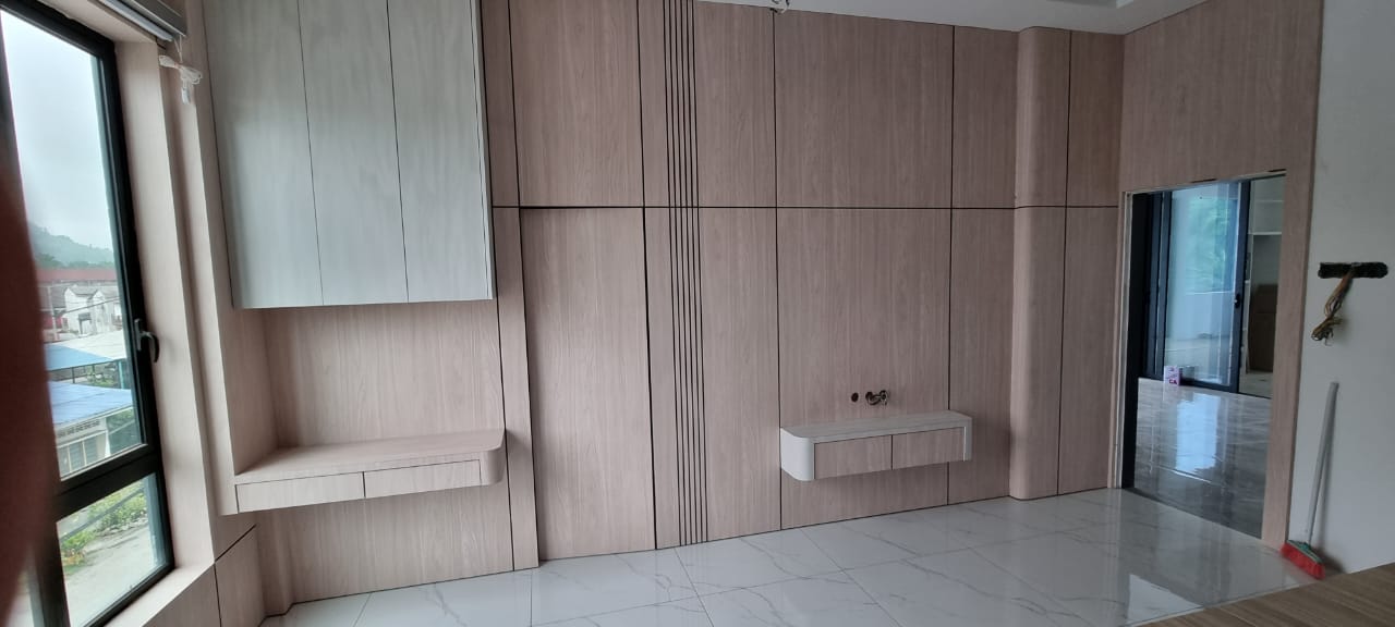 Full room wood panelling with fitted cabinets